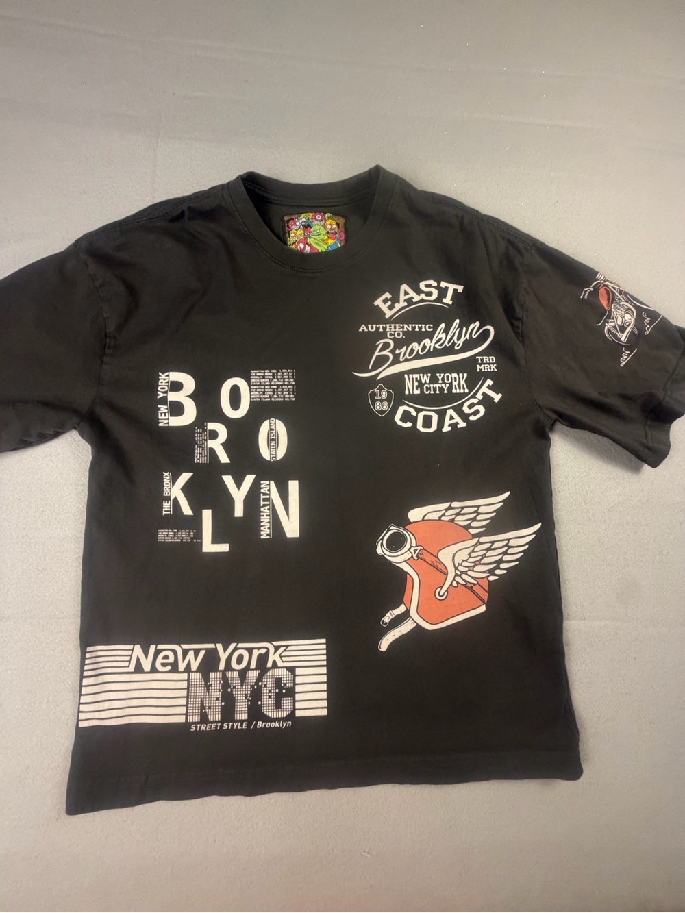 American Garage Men's Black Graphic Brooklyn Tee with Winged Emblem S
